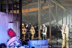 1.19.11..Patricia Hildenbrand Photo..Firefighters inspect a building after putting out a blaze that damaged the main warehouse of the Black Gold Potato Farm in Rhodesdale. Fourteen fire companies and one hundred firefighters responded to the three-alarm fire.  No injuries have been reported and the cause of the fire is still under investigation.