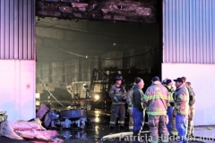 1.19.11..Patricia Hildenbrand Photo..Firefighters inspect a building after putting out a blaze that damaged the main warehouse of the Black Gold Potato Farm in Rhodesdale. Fourteen fire companies and one hundred firefighters responded to the three-alarm fire.  No injuries have been reported and the cause of the fire is still under investigation.