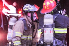 1.19.11..Patricia Hildenbrand Photo..Firefighters check for red embers after putting out a blaze that damaged the main warehouse of the Black Gold Potato Farm in Rhodesdale. Fourteen fire companies and one hundred firefighters responded to the three-alarm fire.  No injuries have been reported and the cause of the fire is still under investigation.