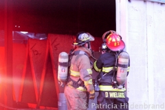 1.19.11..Patricia Hildenbrand Photo..Firefighters check for red embers after putting out a blaze that damaged the main warehouse of the Black Gold Potato Farm in Rhodesdale. Fourteen fire companies and one hundred firefighters responded to the three-alarm fire.  No injuries have been reported and the cause of the fire is still under investigation.